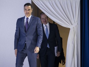 Pedro Sanchez, Prime Minister of Spain, left, arrives ahead of Borge Brende, President, World Economic Forum at the 51st annual meeting of the World Economic Forum, WEF, in Davos, Switzerland, Tuesday, May 24, 2022. The forum has been postponed due to the Covid-19 outbreak and was rescheduled to early summer. The meeting brings together entrepreneurs, scientists, corporate and political leaders in Davos under the topic "History at a Turning Point: Government Policies and Business Strategies" from 22 - 26 May 2022.