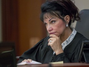 FILE - Judge Rosemarie Aquilina presides at Ingham County 30th Circuit Court in Lansing, Mich., on June 6, 2018. The Michigan Supreme Court on Friday rejected a final appeal from sports doctor Larry Nassar, who was sentenced to decades in prison for sexually assaulting gymnasts, including Olympic medalists. Attorneys for Nassar said he was treated unfairly in 2018 and deserved a new hearing, based on vengeful remarks by a judge who called him a "monster" who would "wither" in prison like the wicked witch in "The Wizard of Oz." (Cory Morse /The Grand Rapids Press via AP)/