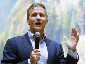 FILE - Former Missouri Gov. Eric Greitens, speaks at the Taney County Lincoln Day event at the Chateau on the Lake in Branson, Mo., April 17, 2021.  Greitens, a Republican candidate for U.S. Senate in Missouri, has posted a campaign video ad on Twitter that shows him brandishing a long gun and declaring that he's hunting RINOs, or Republicans In Name Only.