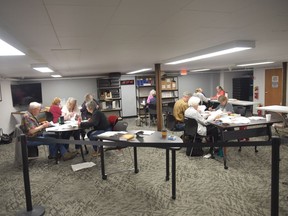 Lincoln county election judges tabulate absentee ballots at the Lincoln County Annex Building in Libby, Mont., Wednesday, June 8, 2022. Ballot printing errors have delayed election results for Montana's new congressional seat, forcing ballots in Lincoln County to be counted by hand.