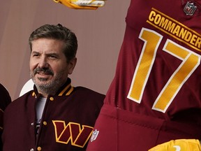 FILE - Dan Snyder, co-owner and co-CEO of the Washington Commanders, poses for photos during an event to unveil the NFL football team's new identity, Wednesday, Feb. 2, 2022, in Landover, Md. A person with knowledge of the situation tells The Associated Press the Washington Commanders have bought land in Virginia for what could be a potential site of the NFL team's next stadium. The 200 acres of land purchased for approximately $100 million is in Woodbridge roughly 25 miles outside the District of Columbia. The Commanders' lease at FedEx Field in Landover, Maryland, expires in 2027.