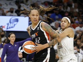 FILE - Phoenix Mercury center Brittney Griner (42) drives past Chicago Sky forward Candace Parker (3) during the first half of Game 1 of the WNBA basketball Finals, Sunday, Oct. 10, 2021, in Phoenix. Brittney Griner will have a place at the WNBA All-Star Game. League commissioner Cathy Engelbert announced the Mercury center will be an honorary starter, Wednesday, June 23, 2022.