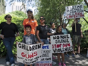 FILE - Protesters chant slogans outside the George R. Brown Convention Center to protest the National Rifle Association annual meeting in Houston, May 27, 2022. March for Our Lives and other gun control groups plan to mobilize supporters on June 11, 2022, to push Congress to require universal background checks, to pass red flag laws allowing guns to be confiscated in certain cases and to raise the age limit to purchase certain guns after recent mass shootings.