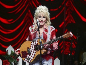 FILE - Dolly Parton performs at Austin City Limits Live during Blockchain Creative Labs' Dollyverse event during the South by Southwest Music Festival on March 18, 2022, in Austin, Texas. Parton is donating $1 million to pediatric infectious disease research at Vanderbilt University Medical Center in Nashville, the organization announced on Wednesday, June 15, 2022. The new gift is one of several Parton has made to the center over the years, including a $1 million gift in April 2020 for COVID vaccine research.