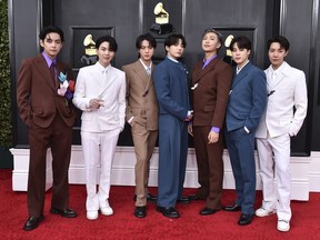 FILE - BTS arrives at the 64th Annual Grammy Awards on April 3, 2022, in Las Vegas. The group says they are taking time to focus on solo projects. The seven-member group with hits like "Butter" and "Dynamite" talked about their future in a video posted June 14, celebrating the nine year anniversary of their debut release.