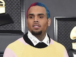 FILE - Chris Brown appears at the 62nd annual Grammy Awards in Los Angeles on Jan. 26, 2020. The owner of a pet breeding business in Florida was sentenced, Wednesday, June 8, 2022, to five years of probation including eight months of home confinement and ordered to pay a $90,000 fine for illegally selling a capuchin monkey to Brown.