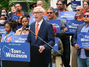 FILE - Wisconsin Gov. Tony Evers speaks at a campaign event outside the state Capitol Friday, May 27, 2022, in Madison, Wis. Evers, a Democrat, hopes to translate anger over the U.S. Supreme Court's overturning of Roe v. Wade into votes this fall as he vows to fight a 173-year-old state abortion ban in any way he can.