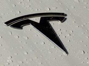 FILE - This Oct. 18, 2019, photo shows a Tesla logo in Salt Lake City. The government plans soon to release data on collisions involving vehicles with autonomous or partially automated driving system that will likely single out Teslas for a disproportionately high number of such crashes. In coming days, the National Highway Traffic Safety Administration plans to issue the figures, which it's been gathering for nearly a year. Last week, the agency said in a separate report that it had documented more than 200 crashes involving Teslas that were using one of the company's partially automated systems. The number of such Tesla crashes was revealed as part of a NHTSA investigation of Teslas on Autopilot that had crashed into emergency and other vehicles stopped along roadways.