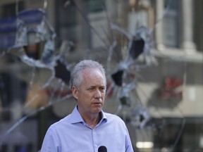 FILE - Louisville Mayor Greg Fischer speaks during a news conference, May 30, 2020, in Louisville, Ky. Fischer was punched in the city's Fourth Street Live! entertainment district on Saturday night, June 18, 2022.