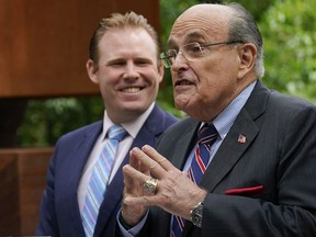FILE - Andrew Giuliani, left, a Republican candidate for Governor of New York, is joined by his father, former New York City mayor Rudy Giuliani, during a news conference, June 7, 2022, in New York. One place the former New York City mayor is in high demand these days is on the campaign of his son, Andrew Giuliani, who on Tuesday is hoping to become the Republican nominee for governor of New York.