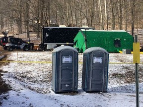 FILE - FBI agents and representatives of the Pennsylvania Department of Conservation and Natural Resources set up a base in March, 2018, in Benezette Township, Elk County, Pa. A lawyer for a father-son team of treasure hunters is accusing the FBI of either lying to a federal judge about having video of its 2018 dig for legendary Civil War-era gold, or illegally destroying the video. The FBI has acknowledged it was looking for gold at the Pennsylvania site but says it found nothing of value. The duo believes the FBI recovered a huge cache of gold and have sued for information about the dig.