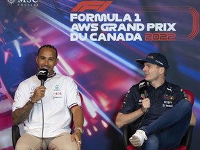 Mercedes Team driver Lewis Hamilton, of Great Britain, and Red Bull Racing driver Max Verstappen, of the Netherlands, share a laugh during a news conference at the Canadian Grand Prix Friday, June 17, 2022 in Montreal.