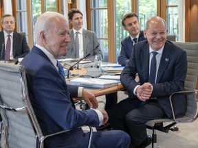 Prime Minister Justin Trudeau joins Italian Prime Minister Mario Draghi, US President Joe Biden, French President Emanuel Macron, and German Chancellor Olaf Scholz around the table for the first plenary session at the G7 Summit in Elmau, Germany on Sunday, June 26, 2022.