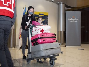 Ukrainian refugees Olga and her daughter Anna clear customs at the St. John's International Airport on Tuesday June 14, 2022. They are with the second group of Ukrainian refugees who arrived on a chartered flight to St. John's.
