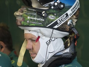 Aston Martin Formula One driver Sebastian Vettel, of Germany, wears a patch on his helmet denouncing Canada's oil sands during the first practice session at the Canadian Grand Prix Friday, June 17, 2022 in Montreal.THE CANADIAN PRESS/Ryan Remiorz