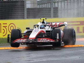 Haas driver Mick Schumacher, of Germany, flies over a curb during the third practice session at the Formula One Canadian Grand Prix in Montreal, Saturday, June 18, 2022.&ampnbsp;Most Formula One teams were in the air en route to Montreal when their sport's governing body announced it was stepping in to counter the troublesome bouncing of cars.