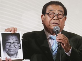 Song Hae, a South Korean TV presenter speaks as he holding his book in Seoul, South Korea, April 30, 2015. Song, who was beloved for decades as the warm-humored emcee of a nationally televised singing contest, has died at the age of 95.