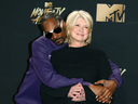 FILE: Snoop Dogg (L) and Martha Stewart pose in the press room during the 2017 MTV Movie & TV Awards at the Shrine Auditorium, in Los Angeles, Calif. on May 7, 2017. / PHOTO BY AFP PHOTO / JEAN-BAPTISTE LACROIXJEAN-BAPTISTE LACROIX/AFP/GETTY IMAGES