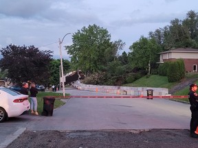 A house is destroyed in a neighbourhood of Saguenay, Que., north of Quebec City, following a landslide last week, as seen in this handout image provided June 20, 2022. About 187 people have since been displaced because of the threat of other landslides.
