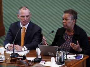 Sonja Gains, Deputy Executive Commissioner of Intellectual and Developmental Disability and Behavioral Health Services, right, and Chance Freeman, Director of Disaster Behavioral Health Services, left, testify on the second day of a hearing in the state senate chamber, Wednesday, June 22, 2022, in Austin, Texas. The hearing is in response to the recent school shooting in Uvalde, Texas, where two teachers and 19 students were killed.