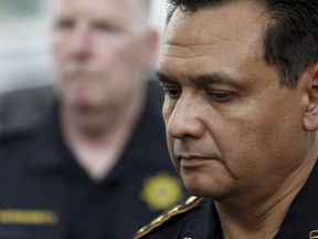 FILE - Harris County Sheriff Ed Gonzalezs pauses as outside a hospital, announcing the identity of the slain Harris County Sheriff's office deputy as Sandeep Dhaliwal in Houston on Sept. 27, 2019. Gonzales has withdrawn from consideration for Immigration and Customs Enforcement director.