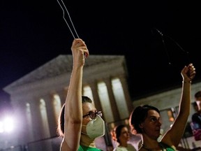 Abortion rights supporters demonstrate in front of the U.S. Supreme Court building.