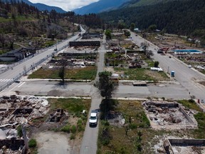 Structures that were destroyed by wildfire are seen in Lytton, B.C., on Tuesday, June 14, 2022. The fire-ravaged community of Lytton, B.C., will get $21 million from the provincial government to help it rebuild essential infrastructure and services.