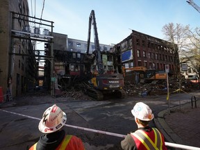 Demolition resumes on the Winters Hotel after a body was found in the single room occupancy (SRO) building, in Vancouver, B.C., Friday, April 22, 2022.&ampnbsp;City officials say one person is dead and two others were injured following a fire at the Empress Hotel, another single room occupancy building, just two months after a fire destroyed the historic Winters Hotel in Vancouver's Gastown neighbourhood.&ampnbsp;THE CANADIAN PRESS/Darryl Dyck