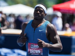 Aaron Brown, of Toronto, races to a first place finish in the men's 200 metre final at the Canadian Track and Field Championships in Langley, B.C., on Sunday, June 26, 2022.