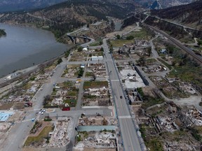 The ruins of houses and businesses are seen in Lytton, B.C., on Wednesday, June 15, 2022, almost a year after the town was destroyed by fire during the heat dome weather event.