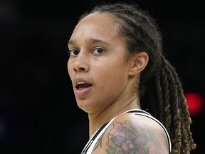 FILE - Phoenix Mercury center Brittney Griner during the first half of Game 2 of basketball's WNBA Finals against the Chicago Sky, Oct. 13, 2021, in Phoenix. Brittney Griner is easily the most prominent American locked up by a foreign country. But the WNBA star's case is tangled up with that of another prisoner few Americans have ever heard of. Paul Whelan has been held in Russia since his December 2018 arrest on espionage charges he and the U.S. government say are false.