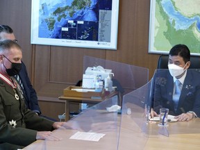 Commander of the U.S. Pacific Marine Corps, Lt. Gen. Steven Rudder, left, meets with Japanese Defense Minister Nobuo Kishi, right, during a courtesy call at the Defense Ministry Friday, June 17, 2022, in Tokyo.