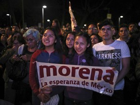FILE - Supporters of presidential candidate Andres Manuel Lopez Obrador, of the Morena party, wait for his arrival at Mexico City's Zocalo plaza, July 1, 2018. In 2022, Mexico's ruling Morena party looks poised to win at least four of the six races for state governorships on June 5th, on the back of President Andres Manuel Lopez Obrador and the absence of a credible opposition, analysts say.