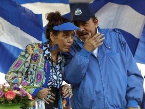 FILE - In this Sept. 5, 2018 file photo, Nicaragua's President Daniel Ortega and his wife and Vice President Rosario Murillo, lead a rally in Managua, Nicaragua. Nicaragua's Sandinista-controlled congress has cancelled nearly 200 nongovernmental organizations this last week of May 2022, ranging from a local equestrian center to the 94-year-old Nicaraguan Academy of Letters, in what critics say is President Daniel Ortega's attempt to eliminate the country's civil society.