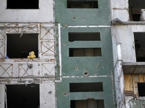 A teddy bear is seen on a building destroyed by attacks in Chernihiv, Ukraine, Sunday, June 19, 2022.