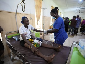 A victim of St. Francis Catholic Church attack receives treatment at St Louis Catholic Hospital in Owo, Nigeria, Monday, June 6, 2022. Lawmakers in southwestern Nigeria say more than 50 people are feared dead after gunmen opened fire and detonated explosives at a church. Ogunmolasuyi Oluwole with the Ondo State House of Assembly said the gunmen targeted the St Francis Catholic Church in Ondo state on Sunday morning just as the worshippers gathered for the weekly Mass.