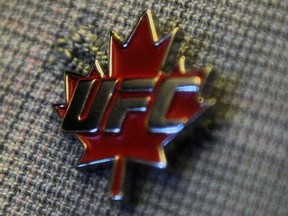 A pin with the Ultimate Fighting Championship logo and a maple leaf is displayed on then-Liberal MP Justin Trudeau's jacket lapel, on Parliament Hill in Ottawa on Thursday, Sept. 29, 2011.&ampnbsp;Canadian featherweight Charles (Air) Jourdain lost a majority decision to&ampnbsp; (Hurricane) Shane Burgos on a UFC Fight Night card Saturday.