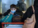 A group of Afghan refugees arrive at Calgary International Airport on Feb. 24.