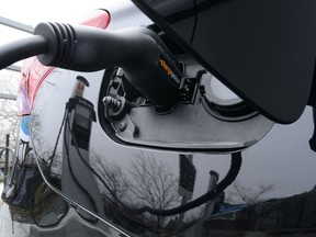 Prime Minister Justin Trudeau says the federal government has reached a deal with Umicore, a global materials technology and recycling group, to build a new battery facility in Ontario's Loyalist Township. A car is charged at a charge station for electric vehicles on Parliament Hill in Ottawa on Wednesday, May 1, 2019.