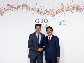 Japanese Prime Minister Shinzo Abe welcomes Canadian Prime Minister Justin Trudeau during the official welcome ceremony at the G20 Summit in Osaka, Japan on June 28, 2019. Prime Minister Justin Trudeau says the assassination of former Japanese prime minister Shinzo Abe is shocking, and that Canada has lost a close friend with his death. Abe was assassinated by a gunman who opened fire on him from behind as he delivered a campaign speech in western Japan. The 67-year-old Abe, who was Japan's longest-serving leader when he resigned in 2020, collapsed bleeding and was airlifted to a nearby hospital where he was later pronounced dead.