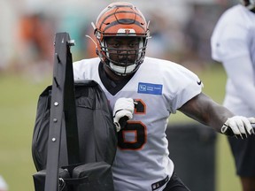 Cincinnati Bengals offensive tackle Kent Perkins runs a drill during NFL football training camp, in Cincinnati, Monday, July 29, 2019. The B.C. Lions have signed Perkins to a two-year contract extension.