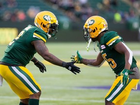 Edmonton's C.J. Gable (2) and Shaquille Cooper (25) celebrate a play against the Ottawa Redblacks during first half CFL action in Edmonton on Friday, August 9, 2019. The Saskatchewan Roughriders have signed veteran running back Cooper.