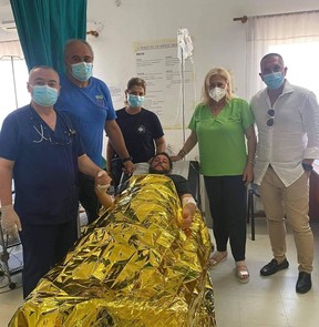 Ivan in the hospital with Mayor Anastasia Halkia, his father and brother.