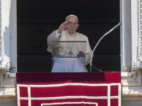 Pope Francis delivers his blessing as he recites the Angelus noon prayer from the window of his studio overlooking St.Peter's Square, at the Vatican on Sunday, July 17, 2022.