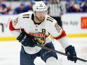 Jonathan Huberdeau (11) skates during the third period of an NHL hockey game against the New York Islanders, in Elmont, N.Y., Tuesday, April 19, 2022. Florida Panthers Huberdeau and MacKenzie Weegar having been traded to the Calgary Flames.