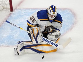 St. Louis Blues goaltender Ville Husso stops a Colorado Avalanche shot during the first period of Game 5 of an NHL hockey Stanley Cup second-round playoff series Wednesday, May 25, 2022, in Denver.