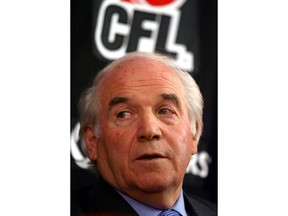 Then-Calgary Stampeders part-owner and former CFL commissioner Doug Mitchell speaks to the media during a news conference in Calgary, Alta., Wednesday, Jan. 12, 2005. Mitchell, a former CFL player who later served as league commissioner, has died. He was 83.