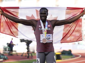 Bronze medalist Marco Arop, of Canada, celebrates after the final in the men's 800-meter run at the World Athletics Championships on Saturday, July 23, 2022, in Eugene, Ore. Arop earned his first career world championship medal with bronze in the men's 800-metre.