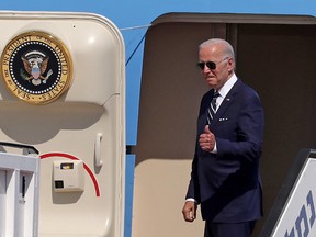 U.S. President Joe Biden gives a thumbs up before boarding Air Force One to depart Israel's Ben Gurion Airport on July 15. Biden is travelling to Saudi Arabia after two-day visit to Israel.