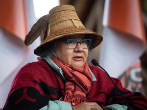 Assembly of First Nations National Chief RoseAnne Archibald wears a hat given to her by the Chehalis First Nation as she speaks during a news conference ahead of a Tk'emlups te Secwepemc ceremony to honour residential school survivors and mark the first National Day for Truth and Reconciliation, in Kamloops, BC., on Thursday, September 30, 2021.